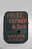 Boltz, Clymer and Co., Philadelphia and San Francisco, countertop cigar trimmer, spring driven cutter in a cast iron case with raised lettering listing the name of the company and "Havana Cigars ".