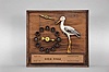 The Attracto Company, Philadelphia, Penn., jeweler's advertising display, spring driven pendulum mechanism in a wood case driving a carved nodding stork figure and rotating arrow pointing to circular display of birthstones, the plaque on the front reading "They Do Stay In / Birthstones Guaranteed" and "W.W.W. Rings ".