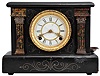 Progressive Mfg. Pana, Ill, "Wizard" 8 day, time and strike spring brass lever movement black mantel clock and trade stimulator. The "Dixon" model clock was supplied by the Waterbury Clock Co.. The clock has a coin slot at the top. When a nickel was deposited, it triggered the strike train of the clock which drives a token dispensing system. A modified countwheel will dispense one, two, and on rare occasion, three tokens in the tray mounted to the side of the clock. Tokens were then exchanged for small items at the retail location. Five coins are included.