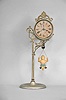 Ansonia Clock Co., New York, "Jumper No. 1" bobbing doll shelf clock with a spring driven one day timepiece movement in a nickel plated case.