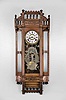 Ansonia Clock Co., New York, "Reflector" wall hanging clock with a spring driven 8 day time and strike (cathedral gong) movement in a walnut case.