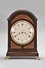 Thomas Harper, London, an 18th century mahogany bracket clock, the case with molded arch top and base, and on brass bracket feet, the case front with three textile backed brass frets, the upper crescent shaped, and the two lower frets conforming to the shape of the dial and case, the sides also with pierced frets, Roman numeral white painted dial with Arabic minutes, finely finished brass hands, two train fusee movement with verge escapement, the back plate with symmetrical foliate engraving and basket of flowers, the upper right corner stamped "2978", counting the hours on a bell, and repeating the last hour on demand