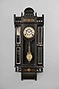 F. Kroeber Clock Co., New York, "Parthia" wall clock with a spring driven 8 day time and strike movement in an ebony case with real marquetries and beveled mirror sides.