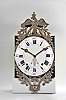 France, Comtoise wall clock, 8 day, time and strike, weight driven movement with verge escapement, thread suspension with front-hanging pendulum in an iron post and plate case with white enamel convex Roman numeral arcaded dial with Arabic minutes, polychrome floral decoration above the 6 o'clock position, two brass sunburst hands, cast brass fronton, the lower portion with a central tree flanked by cornucopias, the top with a profile of Napoleon below the crowned eagle symbol of the Empire.
