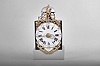 France, bronze-front Louis XV Comtoise clock, 8 day, time and strike with alarm, weight driven movement with alarm, verge escapement with thread suspension and rear-hanging pendulum in a posted frame, enamel dial with concave center and convex chapter, Roman numerals for the hours, large Arabic numerals at 5 minute intervals, brass alarm ring with Arabic numerals, two pierced iron hands, the clock is signed "F. Farjaire / A St. atienne" on an enamel panel below the dial, cast bronze fronton with the Gallic rooster.