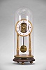 Faivre, a Trevillers, an unusual 8 day, quarter striking skeleton clock with calendar, the clock supported by two gilt columns on square plinths, roman numeral white enamel dial with gilt, palmette ornamented bezel, and date display within the Roman chapter, fancy gilt hands with blued steel date hand, two train, quarter striking movement, the upper half of the front plate with pierced and engraved acanthus leaf ornament, the lower half with acanthus engraving, strike work mounted to the back plate, the quarters sounding on two bells, pendulum with steel rod and brass bob, all resting on a faux marble, turned base with brass feet and dome