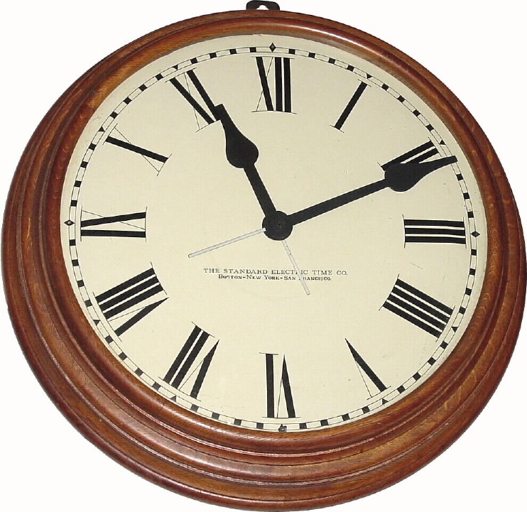 C.1915, Standard Electric Time Co., oak slave timepiece. — Antique Clocks Price Guide