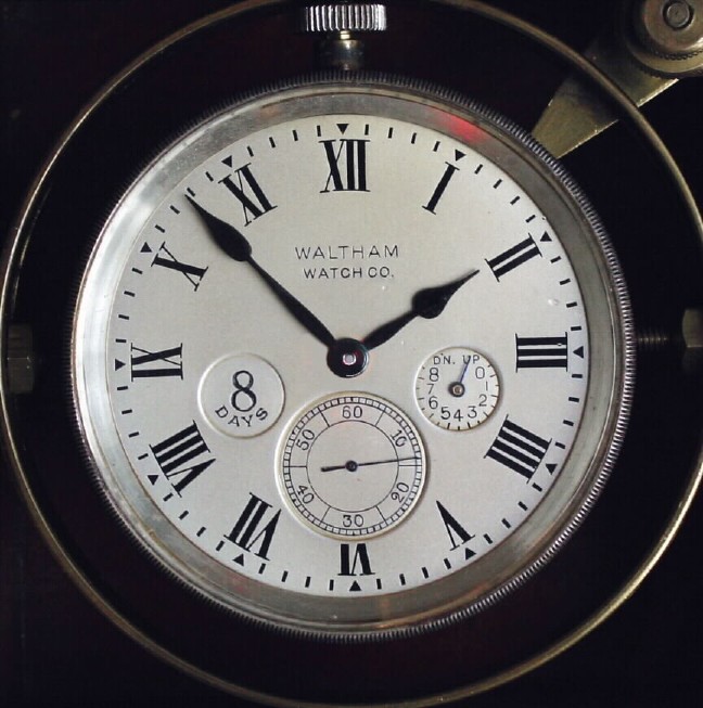 C.1935, Waltham Watch Co., 8-day Deck Watch housed in a mahogany display top gimbaled case, — Antique Clocks Price Guide