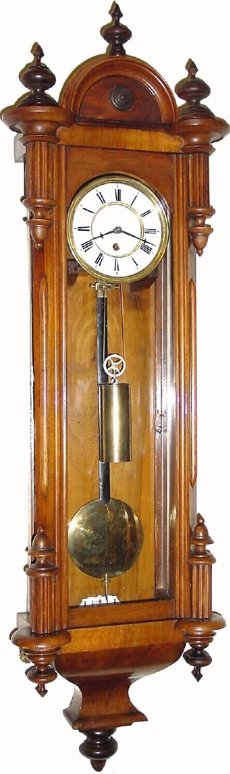 C.1870, Austrian, 1-Weight timepiece in a walnut case with canted corners and inverted finial trim. — Antique Clocks Price Guide