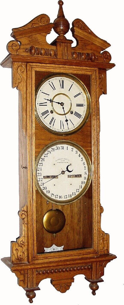 C.1900, Waterbury Clock Co., Calendar No. 33, double dial, perpetual calendar clock, in very good condition. — Antique Clocks Price Guide