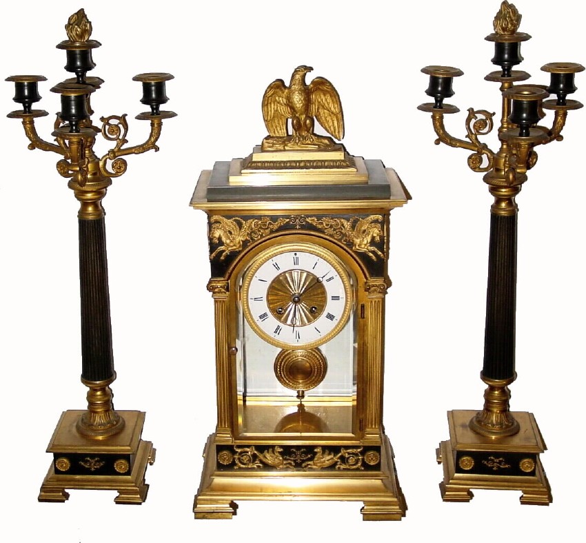 C.1900, French, Marti, Ormolu and Bronze Crystal regulator set with candelabras, and in good original condition with bright gilding and dark green bronze intact. — Antique Clocks Price Guide