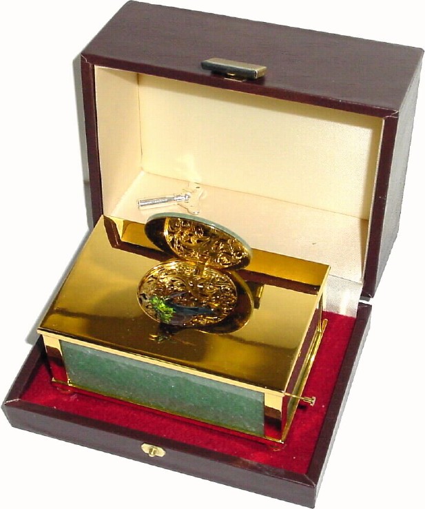 C.1975, Swiss, Reuge Music Co, St. Croix,singing bird box in a polished jade and gold plated case, in original leather covered presentation box. — Antique Clocks Price Guide