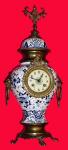 C.1895, French, Blue and White Porcelain Urn with cast bronze ornaments, the clock movement in the belly of the urn, and in very good original condition, running. — Antique Clocks Price Guide