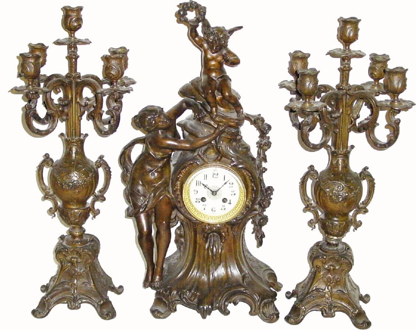 C.1890, French, Bronzed Spelter Clock set with candelabras. — Antique Clocks Price Guide
