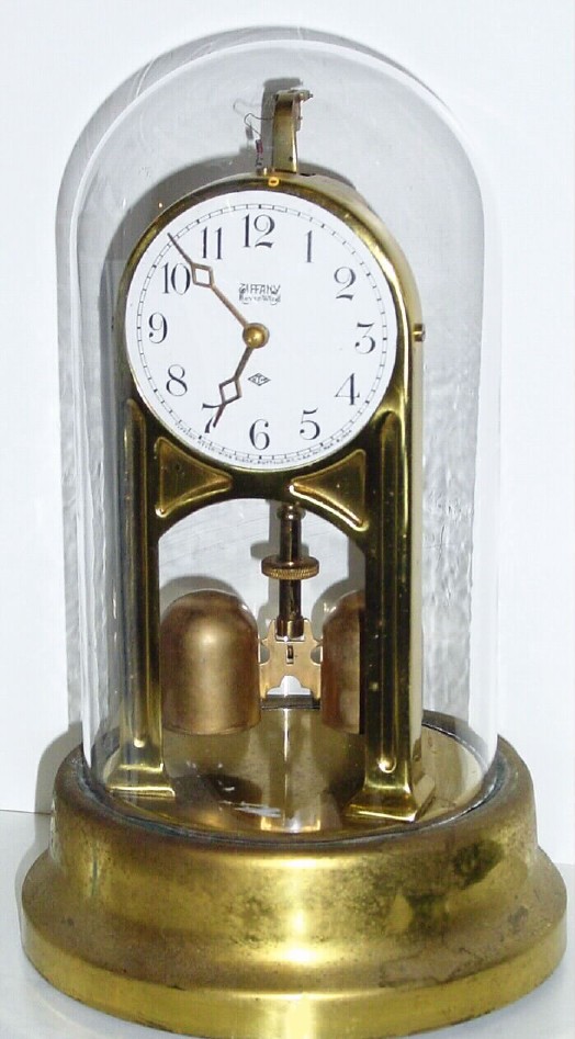 C.1910, Tiffany Never-Wind Clock Co., Buffalo, NY, battery clock in excellent original condition including dome (no battery). — Antique Clocks Price Guide