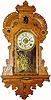 C.1905, Seth Thomas Clock Co., "King Bee" 8-day time/strike/alarm Oak hanging gingerbread clock, in excellent restored condition.