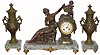 C.1900, French, LE RAISIN, figural clock set with side garnitures.