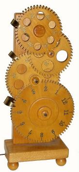 C.1985, Clockwork, Inc, Sun Prairie, Wisconsin, novelty 110v electric clock, with four well cut wooden gears, the seconds gear driven by a synchronous motor. — Antique Clocks Price Guide