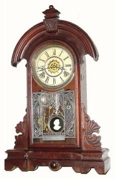 C.1883, Waterbury Clock Co., "Windham", 8-day time/strike/alarm walnut shelf clock. — Antique Clocks Price Guide