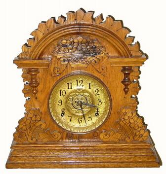 C.1893, E. Ingraham and Co., "Cabinet No. 2" eight-day oak cabinet clock with alarm. — Antique Clocks Price Guide