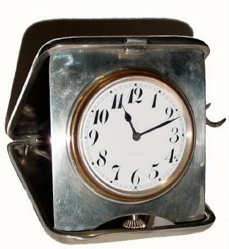 C.1900, Swiss, 1/4 Repeating, 8-day Travel clock, in a marked sterling, latching travel case with the initials JEG. — Antique Clocks Price Guide