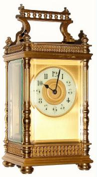 C.1900, French, Brass Cased Carriage timepiece in a fancy column case with embossed brass bands top and bottom and little turned finials within the handle. — Antique Clocks Price Guide
