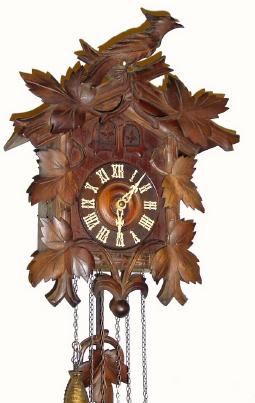 C.1920, German, 30-hour time and quarter strike Cuckoo and Quail wall clock. — Antique Clocks Price Guide