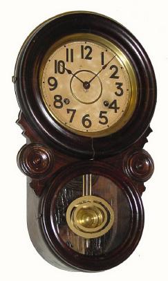 C.1900, E. Ingraham and Co., "Ionic" 8-day time/strike wall clock in good condition except for bottom glass. — Antique Clocks Price Guide