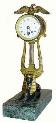 C.1920, French, Lyre Clock with Egyptian motif. — Antique Clocks Price Guide