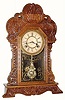 C.1906, Waterbury Clock Co., "Davis", Walnut Gingerbread clock in very good restored condition.