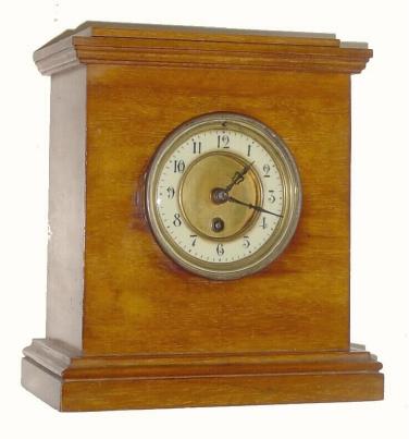 Mixed lot, but serviceable. C.1890, good Round French movement complete, now in a C.1920 well made butternut case. — Antique Clocks Price Guide