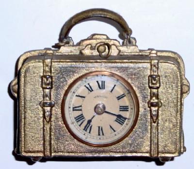 C.1892, E. N. Welch, "Little Grip", suitcase novelty, with damaged handle (ring on left side broken), and rear winder missing. — Antique Clocks Price Guide