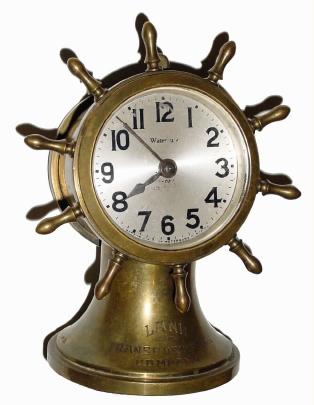 C.1925, Waterbury, ENSIGN, desk timepiece, ships wheel motif, with rim wind and lever set 8-day jeweled movement. — Antique Clocks Price Guide