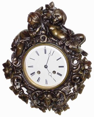 C.1875, French, Japy Freres, Small Patinated spelter cartel clock. — Antique Clocks Price Guide