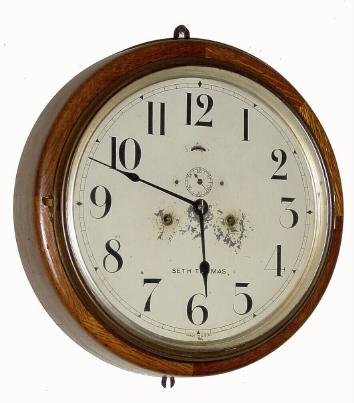 C.1924, Seth Thomas Clock Co., 8-day wall timepiece. The refinished oak case is in very fine condition. — Antique Clocks Price Guide
