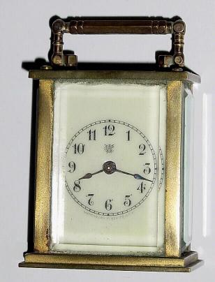 C.1905, Waterbury Clock Co., "SPECK", brass cased carriage timepiece miniature in generally good condition. — Antique Clocks Price Guide