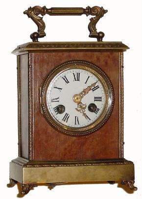 C.1900, French, Japy Freres, small portable clock, the case of birds-eye maple with cast brass trim. — Antique Clocks Price Guide