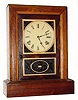 C.1870, Jerome and Co., (New Haven) , 8-day rosewood cottage clock with guttu purcha or thermo-plastic inserts in the door.