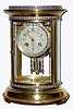 C.1900, French crystal regulator, 8-day time and strike, in an oval case with 3 bands of multi color enamel decoration going around the case,
