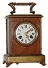 C.1900, French, Japy Freres, small portable clock, the case of birds-eye maple with cast brass trim.