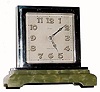 C.1935, Swiss, 8-Day Partners Desk clock in an Art Deco case of nickeled brass with a stepped onyx base,