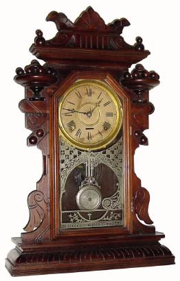 C.1890, Waterbury Clock Co., 8-day time & strike walnut Gingerbread in generally good as-found condition. — Antique Clocks Price Guide