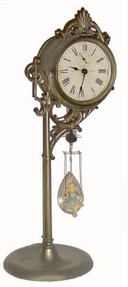 C.1894, Ansonia Clock Co., "Jumper No. 1", 30-hour bobbing doll timepiece in generally good condition, — Antique Clocks Price Guide