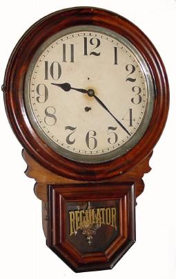 C.1905, E. Ingraham & Co., "Dew Drop", 8-day wall timepiece in very nice condition with original grain painting on the doors. — Antique Clocks Price Guide