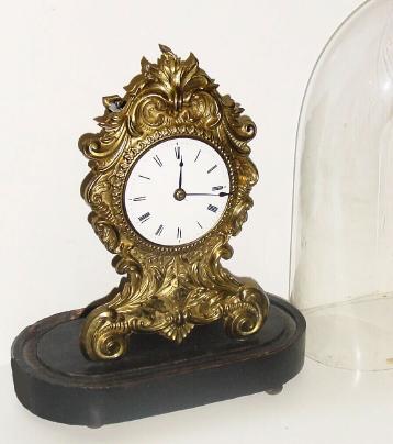 C.1850, Chauncey Jerome, New Haven, Conn., 30-hour lever movement brass front timepiece that imitates a French clock is in very nice condition with a perfect porcelain dial. — Antique Clocks Price Guide