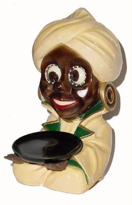 C.1950, German, "Oswald" molded Fakhir (Genie) rolling eye novelty. — Antique Clocks Price Guide