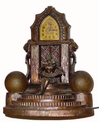 C.1935, Lux Manufacturing Co., Waterbury Conn., "JESTER", Art Deco, patinated white metal clock and lamp. — Antique Clocks Price Guide