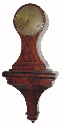 C.1810, John Wareham, London, 8-day fusee balloon clock. This large highly figured mahogany veneered timepiece is in very nice condition with some damage where the bezel latch is found. — Antique Clocks Price Guide