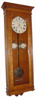 C.1900, Standard Electric Time Co., Waterbury, Conn., master clock, complete with pilot clock, voltage meter and original damascene pendulum. — Antique Clocks Price Guide