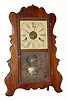 C.1852, E. & A. Ingraham, Bristol, Conn., 30-hour time/strike scroll front shelf clock.